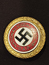 Large NSDAP 30.5 mm Golden Party badge marked Ges. Gesch